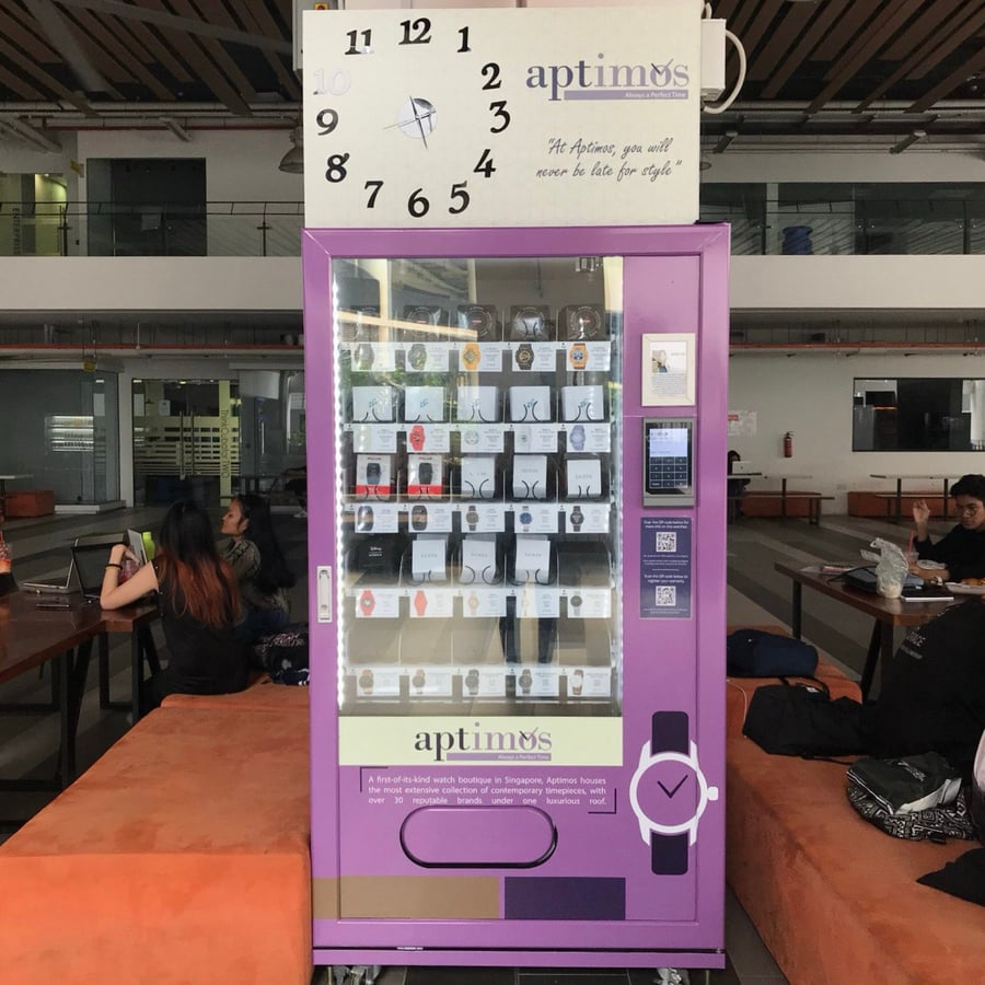 Vending machine selling watches on a campus